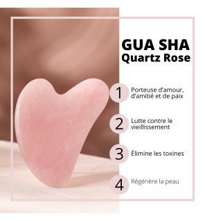 gua sha placé près d’une bougie et d’un peigne en bois pour rituel bien-être