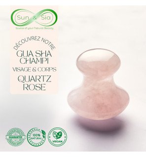 outil de soin visage en quartz rose à côté d’un sérum