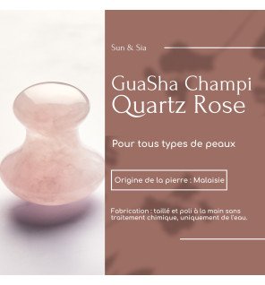 accessoire bien-être en pierre rose sur une table de salle de bain