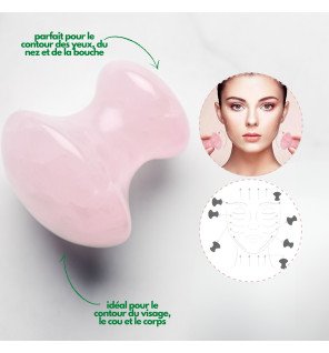 accessoire de beauté en pierre naturelle posé près d’une plante verte