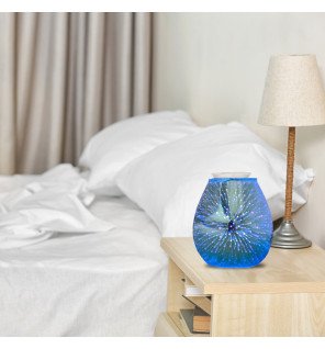 pack trio de noël huiles essentielles posé à côté du diffuseur sur une nappe blanche