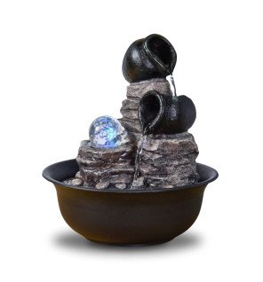  fontaine d'intérieur nature installée dans une chambre pour favoriser la relaxation avant le coucher