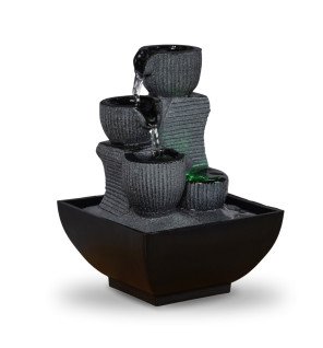  fontaine d'intérieur zen'light placée près d'une fenêtre pour profiter de la lumière naturelle et du son relaxant