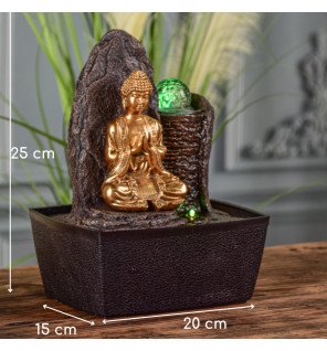  fontaine bouddha placée sur un meuble en bois clair