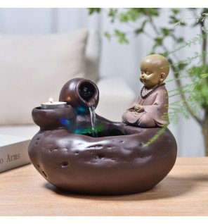  fontaine bouddha medina placée dans une chambre pour favoriser la détente avant le sommeil