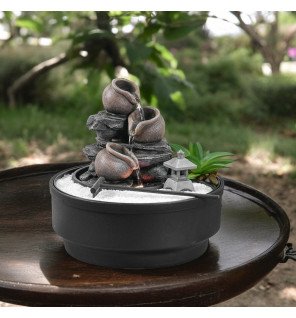  lumière douce intégrée illuminant la fontaine pour une atmosphère apaisante en soirée