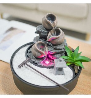  ambiance tamisée avec la fontaine oasis diffusant une lumière chaleureuse dans la pièce