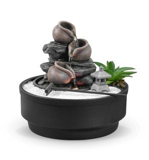  fontaine jardin zen oasis placée dans une entrée pour accueillir les invités avec une touche zen