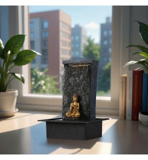  fontaine décorative bouddha en résine grise avec lumière douce allumée dans un coin détente