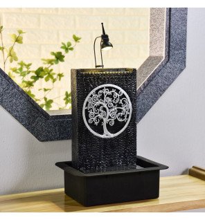  ambiance cocooning avec la fontaine placée près d'une fenêtre