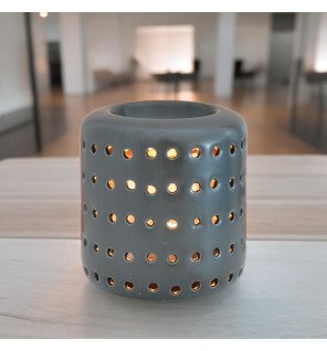  brûle-parfum coliseo noir avec huiles essentielles à côté