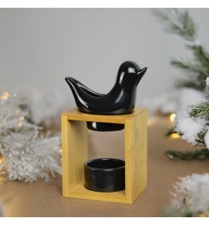  brûle-parfum birdy noir avec une bougie chauffe-plat allumée à l’intérieur