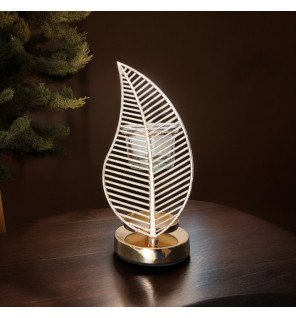  diffuseur palme utilisé lors d’un moment de détente avec un livre et une tasse de thé