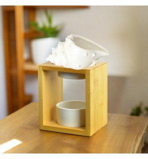  détail du design arrondi du brûle-parfum shell pour une touche moderne