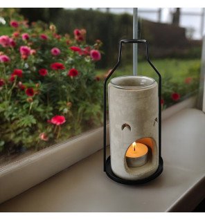  brûle-parfum inspiration una avec une lumière tamisée en arrière-plan