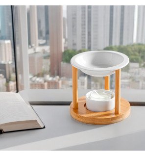  brûle-parfum simplicity athena posé près d’un livre et d’une tasse pour une ambiance cocooning