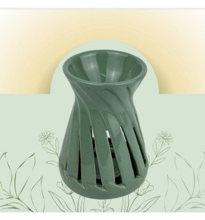  vue rapprochée sur la texture de la céramique verte du brûle-parfum