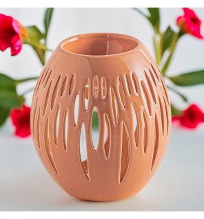  ambiance zen avec le brûle-parfum ovali terra diffusant une douce lumière tamisée