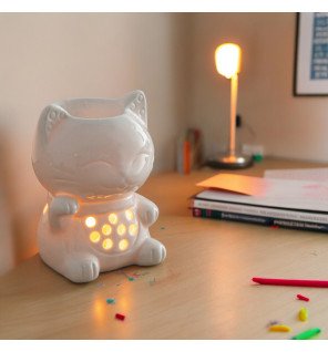  brûle-parfum tommy utilisé lors d’un rituel de relaxation avec bougie chauffe-plat