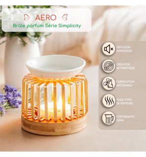  brûle-parfum posé près d’une fenêtre laissant entrer la lumière naturelle