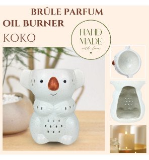  ambiance zen avec le brûle-parfum koala entouré de bougies allumées