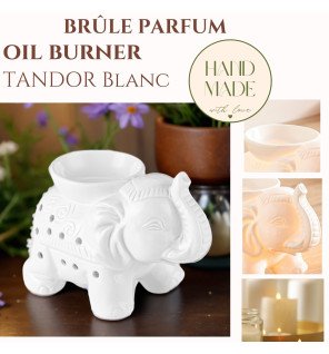  ambiance cocooning avec brûle-parfum blanc et bougie allumée à côté