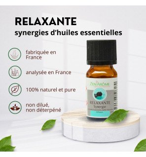 flacon de synergie d'huiles essentielles relaxante 10 ml de la marque zen'arôme posé sur une table en bois