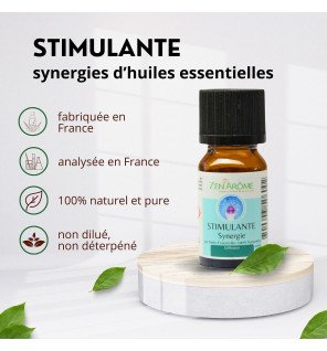 flacon de 10 ml de la synergie d'huiles essentielles stimulante zen'arôme posé sur une table en bois clair