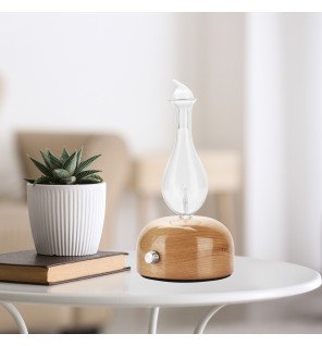  ambiance zen avec le diffuseur aurora entouré de coussins et bougies