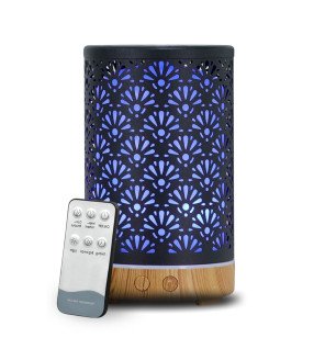  diffuseur sofia zen'arôme posé sur une table de chevet apportant une touche de bien-être à la chambre