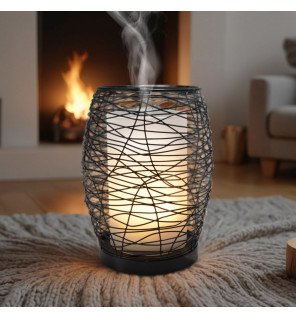  diffuseur d'huiles essentielles posé sur une table de nuit avec lumière led douce pour une ambiance relaxante