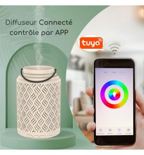  diffuseur connecté placé sur une étagère entouré de plantes vertes