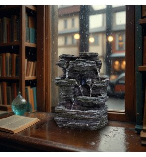  fontaine décorative en résine effet pierre avec eau en cascade et lumière douce pour ambiance zen