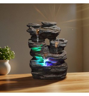  mise en scène de la fontaine pietra dans un coin lecture avec lumière tamisée