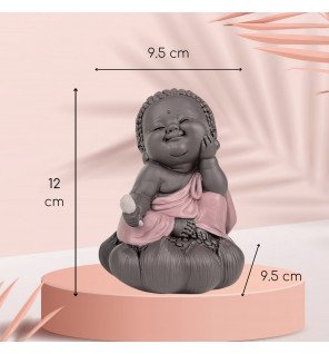  statue bouddha en cogitation associée à des bougies pour créer un espace propice à la relaxation