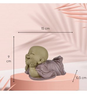  décoration zen en bronze installée dans un coin lecture cosy