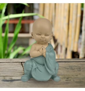  ambiance relaxante créée par la statue sur un meuble en bois clair