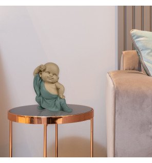  sculpture gongfu 2 placée près d’une plante verte pour une touche naturelle