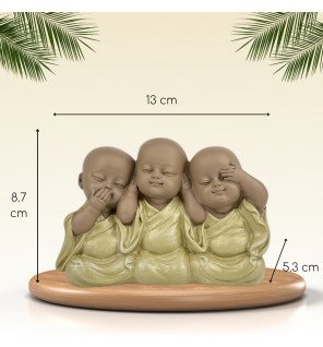  ensemble des trois bonzes sous une lumière tamisée créant une atmosphère relaxante