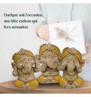  statues ganesh jaune en céramique installées près de plantes vertes pour une décoration harmonieuse