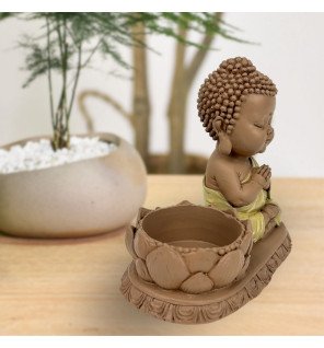  bougeoir bouddha en résine grise avec bougie allumée