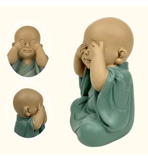  statue bonze vue placée près de plantes vertes pour une atmosphère naturelle et harmonieuse