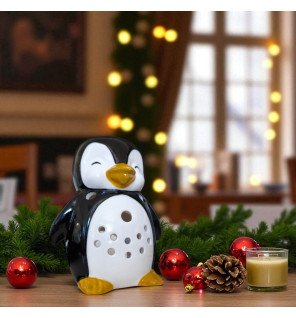  ambiance zen avec le brûle-parfum pingouin et quelques bougies allumées