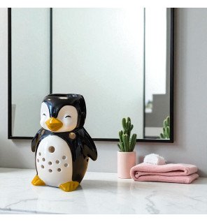  brûle-parfum pingouin entouré de fleurs séchées pour une ambiance naturelle