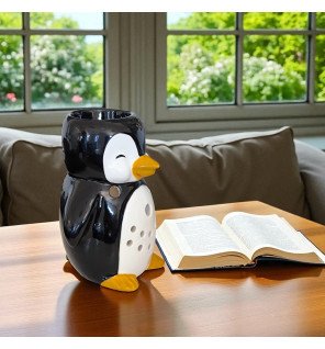  mise en scène du brûle-parfum pingouin avec des accessoires de bien-être