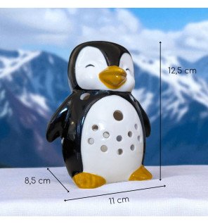  pingouin brûle-parfum placé près d’une fenêtre pour capter la lumière du jour