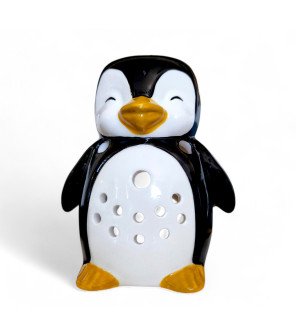  brûle-parfum pingouin en céramique utilisé comme objet décoratif dans une chambre chaleureuse