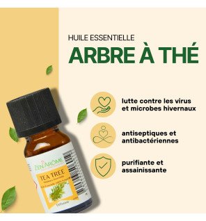  huile essentielle arbre à thé 10 ml à côté d’une bougie allumée pour une ambiance relaxante