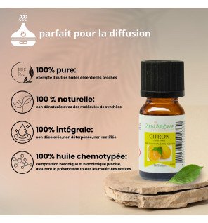  bouteille d’huile essentielle citron entourée de zestes de citron frais