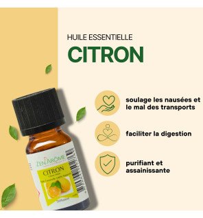  bouteille d’huile essentielle citron posée sur un tissu naturel beige